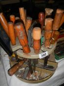 A circular tool stand with tools.