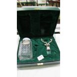 A cased Glenfiddich whisky decanter with stag head stopper and silver lable (no contents)