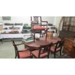 An oval mahogany dining table and six chairs. COLLECT ONLY.