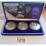 A cased silver proof crown set of three Diana, Princess of Wales 'The Work Continues' with