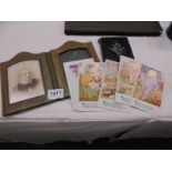 A Victorian photograph album, a folding frame and a quantity of Phyllis M Purser postcards.