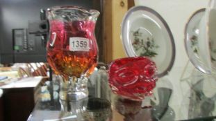 Two pieces of red studio glass.