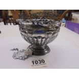 A silver rose bowl, 160 grams and a silver whisky label.