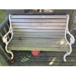 A garden bench. oak slats and cast ends, in good condition. 49inc long. Collect Only.