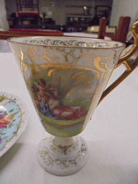 A hand painted Austrian tea cup and saucer. - Image 2 of 2