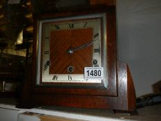 A 1930's oak mantel clock with three key holes.
