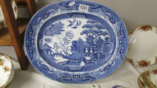 A blue and white Stoneware meat platter.