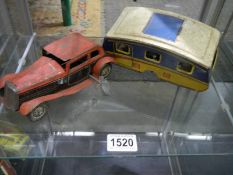 A pre/post ware clockwork tinplate car with caravan, (caravan missing a wheel.)