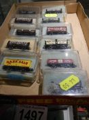 Eleven boxed Peco 'N' gauge goods wagons.