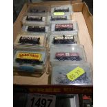 Eleven boxed Peco 'N' gauge goods wagons.