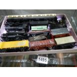 A quantity of unboxed '00' gauge rolling stock, coaches and locomotives.