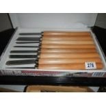 A box of wood turning chisels.