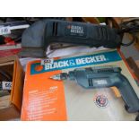 A Black & Decker drill and corner sander.