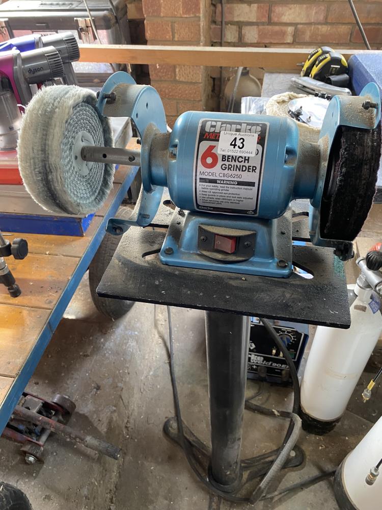 A Clarke 6" bench grinder with attachments. Collect Only.