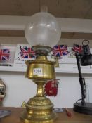 A brass oil lamp complete with chimney and acid etched shade, COLLECT ONLY.