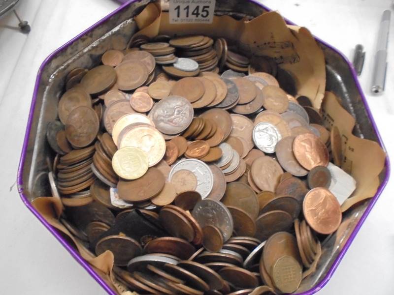 A tin of old coins.