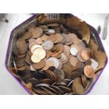 A tin of old coins.