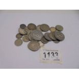 A collection of foreign silver coins, approximately 119 grams.
