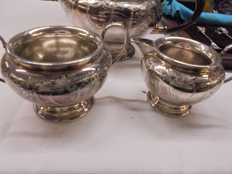 A three piece silver plate tea set. - Image 2 of 3