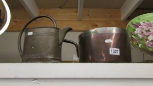 A Victorain copper saucepan and a watering can.