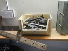 A box of hand tools, a tool box and clamp.