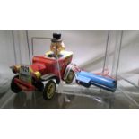 A vintage tinplate Yonezawa battery operated Willy the Walking car,