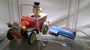 A vintage tinplate Yonezawa battery operated Willy the Walking car,