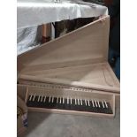 A wooden harpsichord, case and three books. Collect Only.