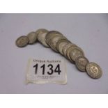 Sixteen Swiss silver coins, approximately 70 grams.