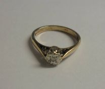 A diamond single stone ring, London hall mark, yellow gold shank, size M.