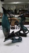 A Poole Pottery dolphin and two other unmarked pottery items.
