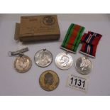 Three WW2 medals and two other medals.