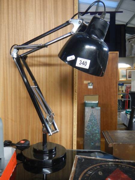 An industrial workbench with adjustable lamp.