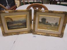 A pair of gilt framed oil on board rural scenes signed Gary Rayner, 28 x 21 cm.