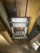 An extending metal telescopic ladder. Collect Only.