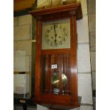 A 1930's oak wall clock. COLLECT ONLY.