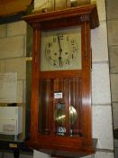 A 1930's oak wall clock. COLLECT ONLY.