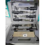 A cased set of chisels.