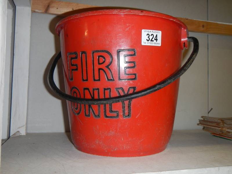 Red plastic fire bucket.
