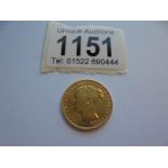 An 1874 Victorian gold sovereign.