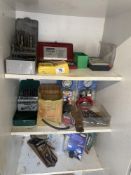A large lot of drill bits, small socket set, compression tester, vacuum tester etc.