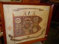 A framed and glazed 'The Royal Dragoon' embroidery.
