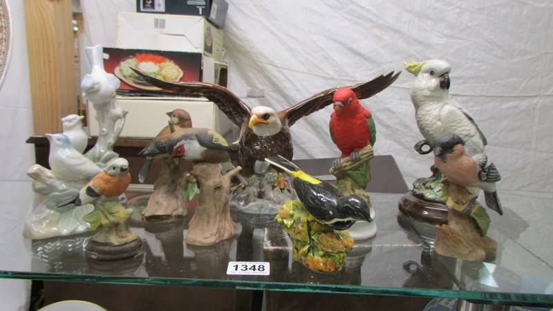 A mixed lot of bird ornaments including Beswick Eagle, Crown Derby etc.,