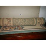 A green and cream floral rug, 80 x 152 cm, COLLECT ONLY.