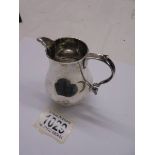 A silver cream jut, 8cm tall, 98 grams (some dints).