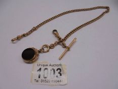 A 9ct gold Watch Albert with onyx fob, total weight 35 grams.