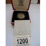 A cased 2000 silver proof £1 Wales coin with certificate.