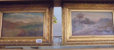 A pair of gilt framed oil on board rural scenes.