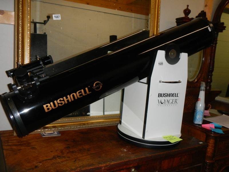 A Bushnell Voyager 150 mm Dobsonian telescope on stand and with storage box. COLLECT ONLY.