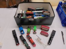 A collection of ERTL Thomas and Friends engines and carriages.